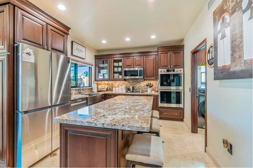 Kitchen, showing entrance to laundry room in far right corner.