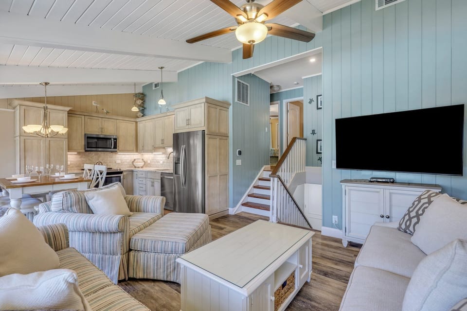 Living room with tv and queen sleeper sofa.