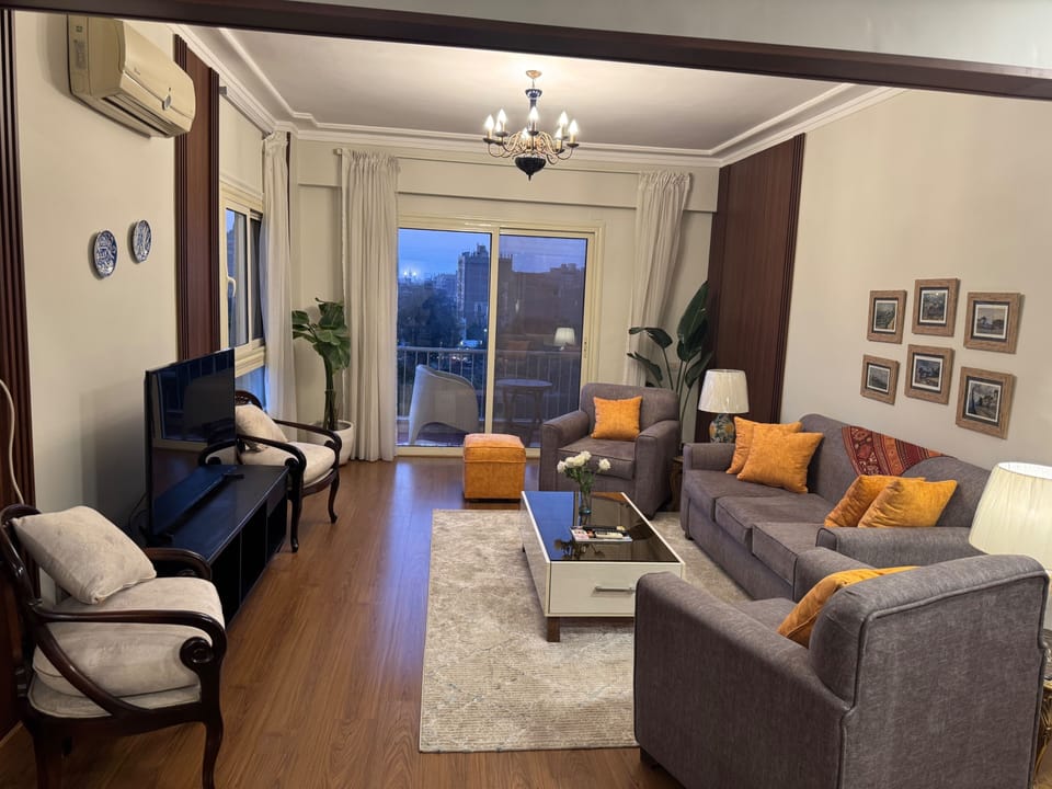 The Living room is wide & has many sitting areas (Sofa's & armchairs) with a flat smart TV screen, it is air-conditioned and comfortable area over looking the Nile River through window & balconies.