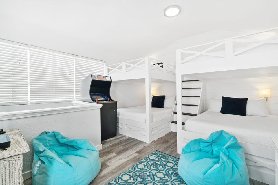 Level 3 Queen over Queen Bunk Beds with Game Machine and Balcony overlooking Pool