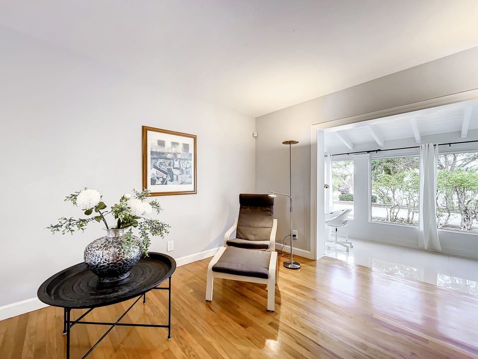 Living room in the foregroud, den/office in the background