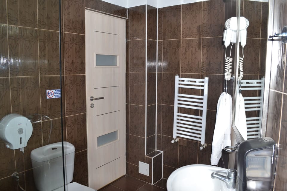 Basic Single Room, 1 Twin Bed, Refrigerator, City View (Single Room) | Bathroom | Combined shower/tub, rainfall showerhead, hair dryer, towels