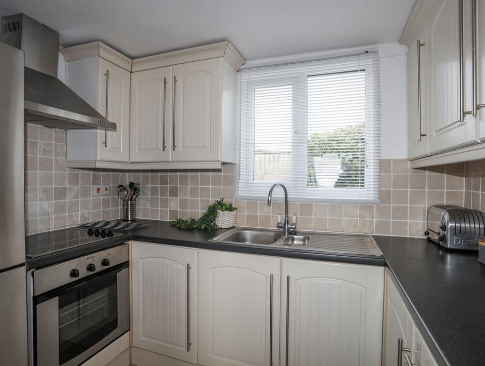 Fridge, electric kettle, toaster, cookware/dishes/utensils