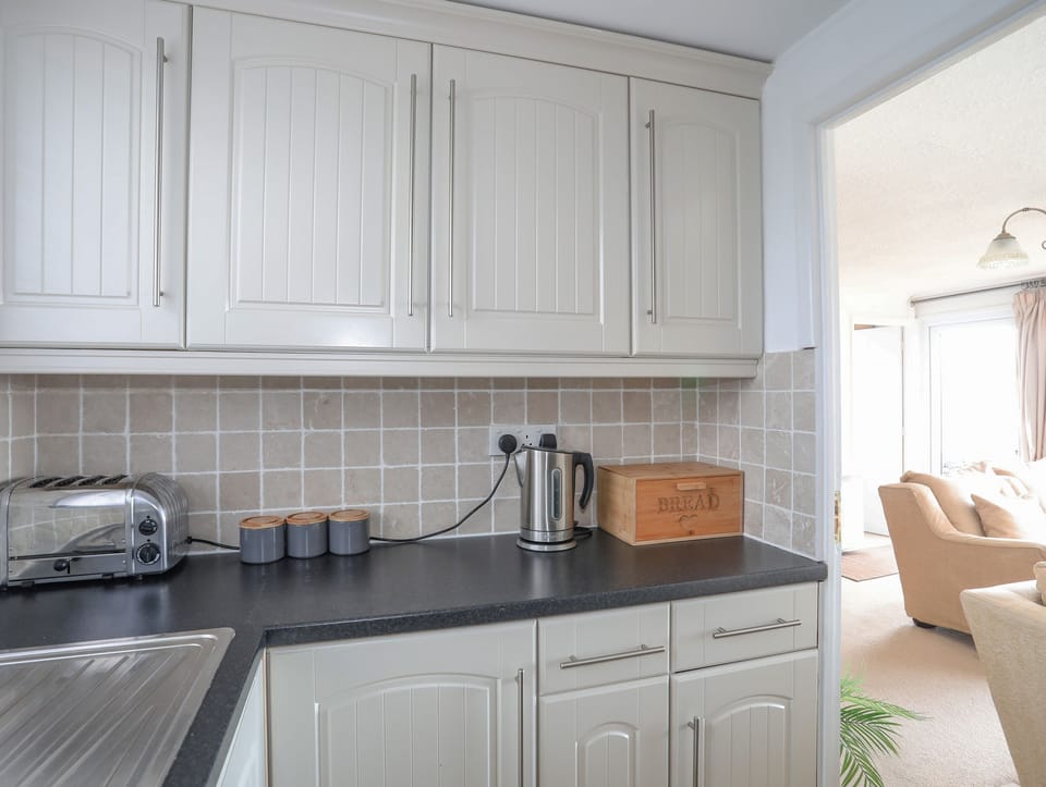 Fridge, electric kettle, toaster, cookware/dishes/utensils