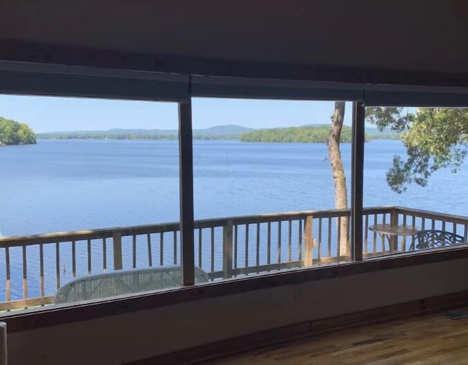 15 feet of windows showcase an amazing view of the lake, island and mountains.