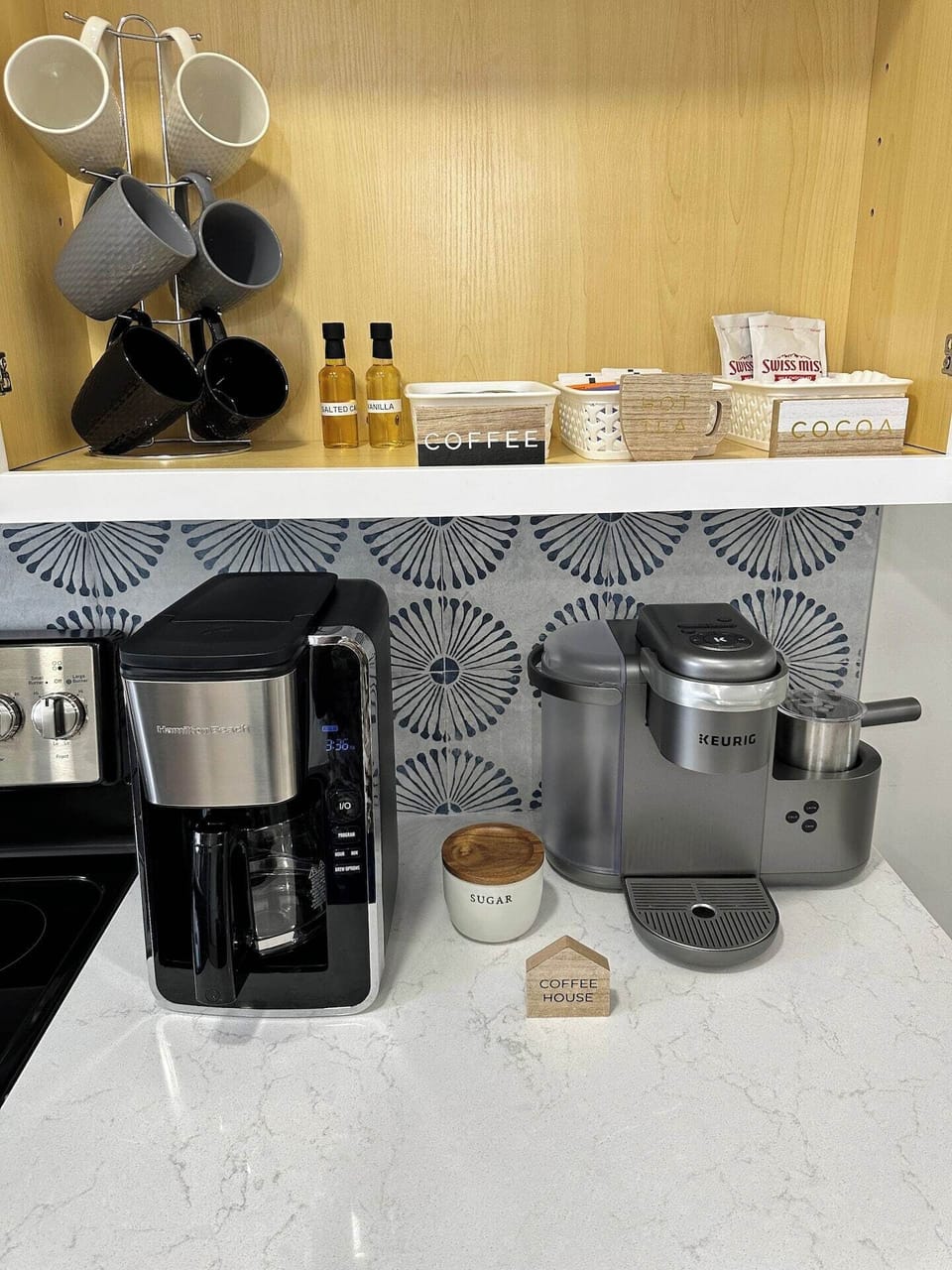 A hot beverage bar just for you!  A starter set of coffee, tea and hot cocoa awaits you with flavored syrup, sugar and creamer.