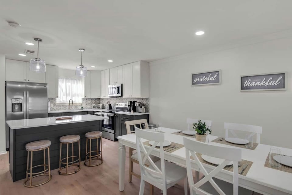 Kitchen island seating for 3 and dining room table seats 6.