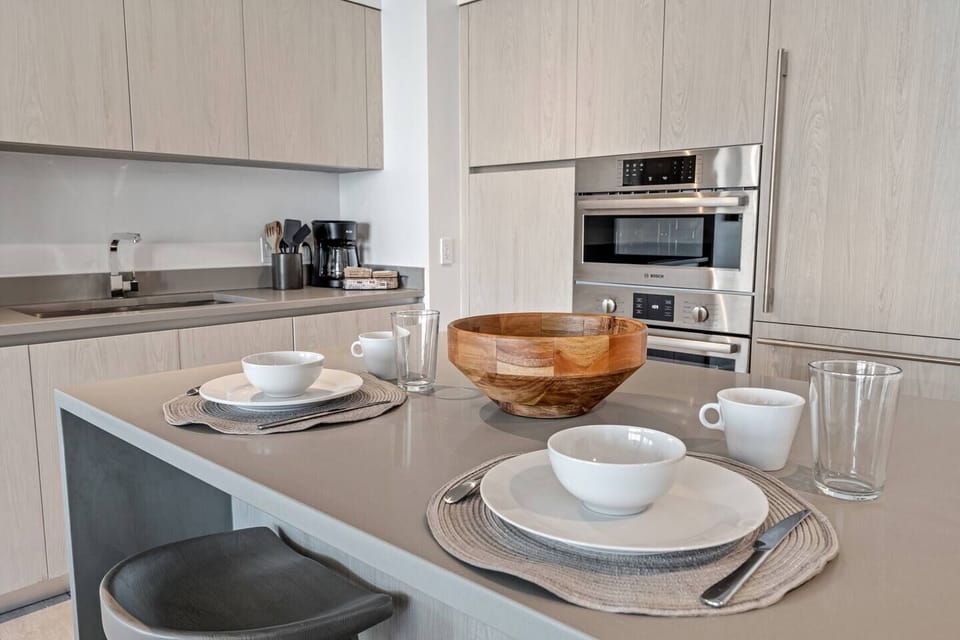 The kitchen features Bosch appliances and is fully equipped for cooking a full meal.