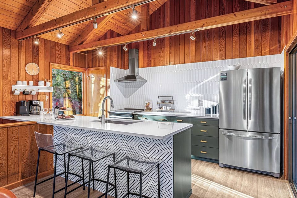 Fully stocked open kitchen will allow you to make your favorite drink or your best breakfast spread while still enjoying company and views of the outdoors.
