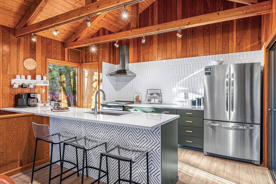 Fully stocked open kitchen will allow you to make your favorite drink or your best breakfast spread while still enjoying company and views of the outdoors.