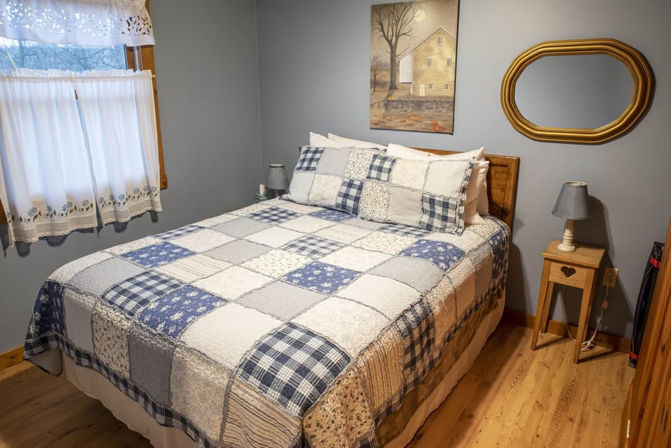 Downstairs bedroom with queen bed.