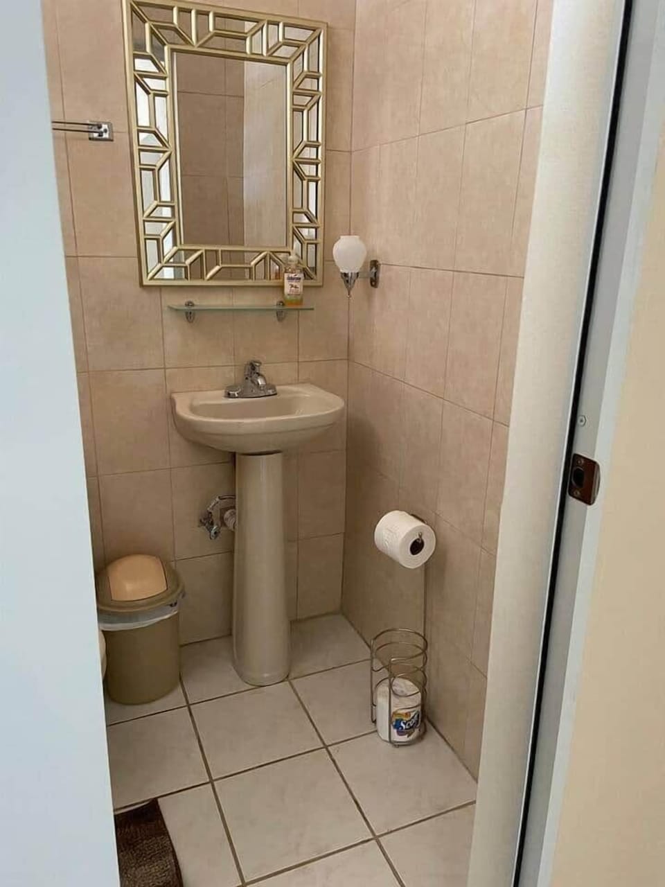 Full bath with a shower water heater.