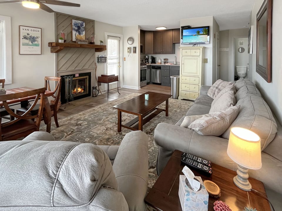 Enjoy the living room with cozy fireplace, 2 walk out decks.  Family time.