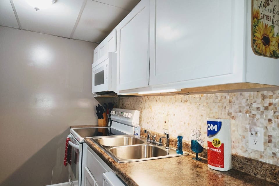The kitchen comes equipped with tools needed to cook those family meals (Fridge to the left and not pictured)
