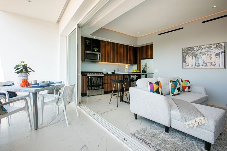 Sliding doors open up to the adjacent balcony