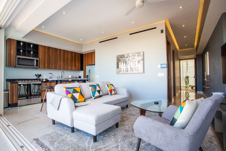 Comfortable sofa in living area in front of the TV