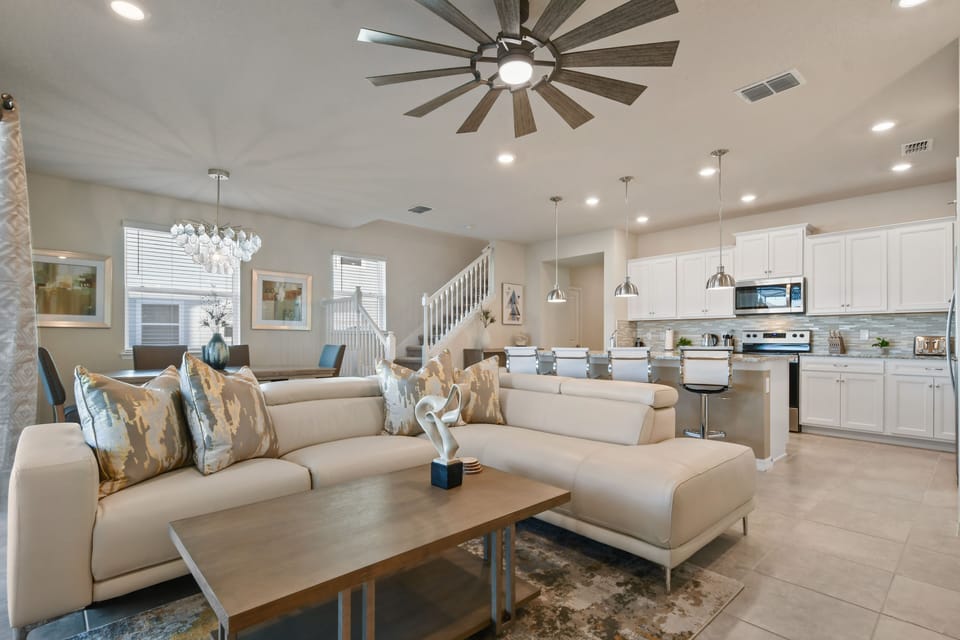 Spacious Downstairs Living Area with Comfortable Seating and Flat Screen TV