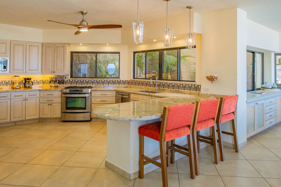 Fully equipped kitchen with bar seating