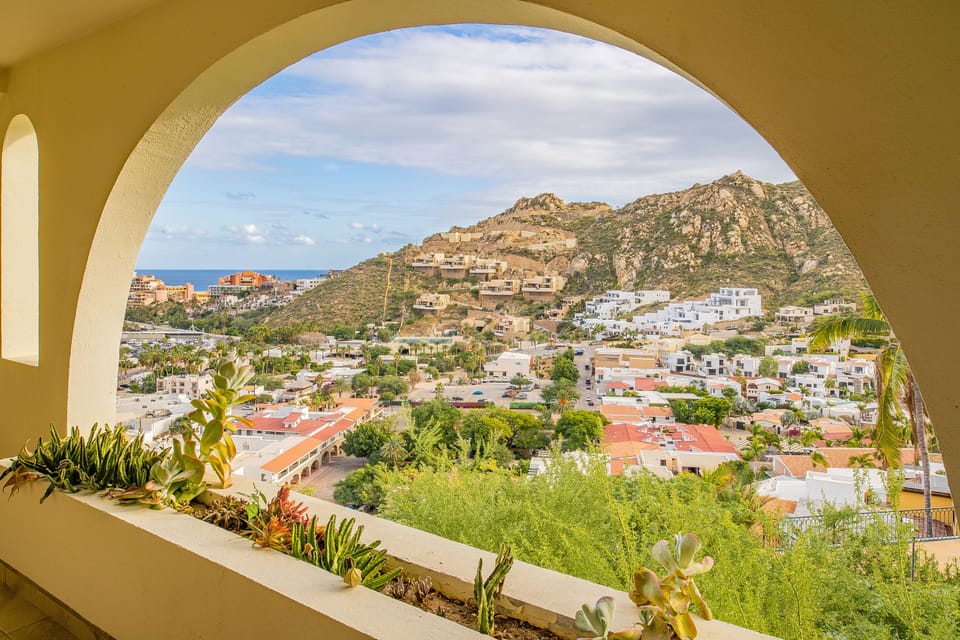Arch window frame with city and ocean view
