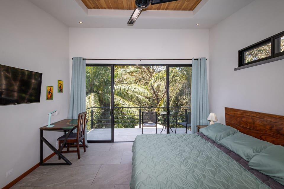 Upstair (jungle) bedroom has a private patio with a view of the jungle canopy