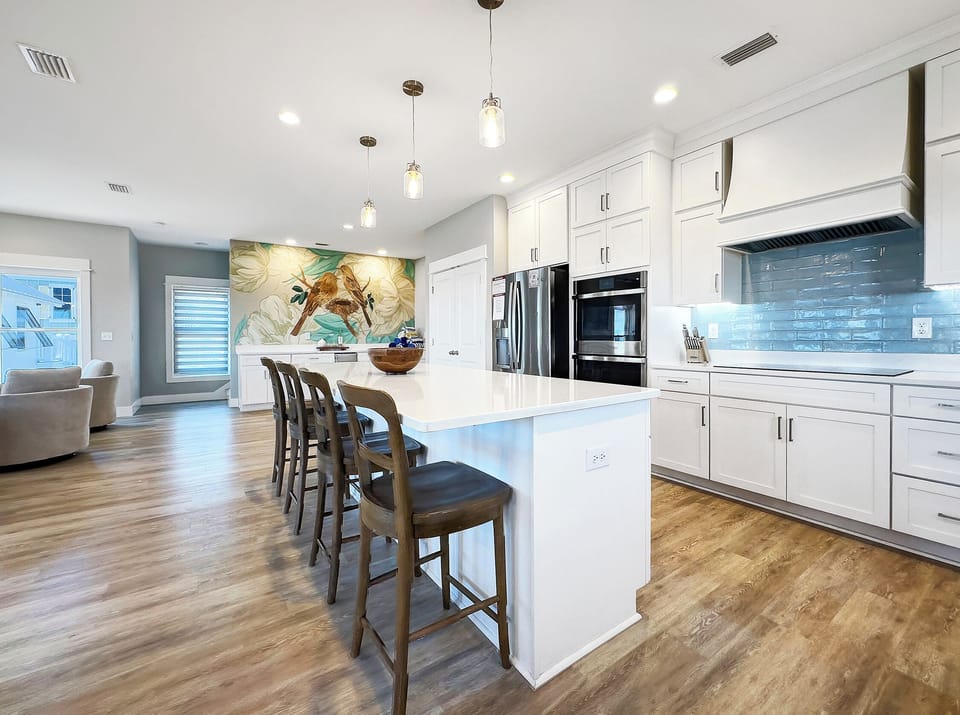 A large kitchen island provides for plenty of gathering space. 