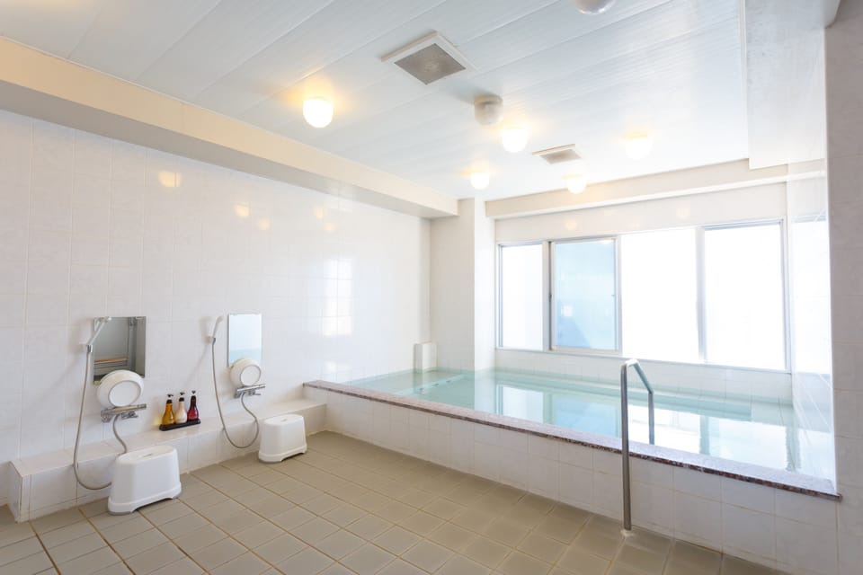 Combined shower/tub, hair dryer, slippers, electronic bidet
