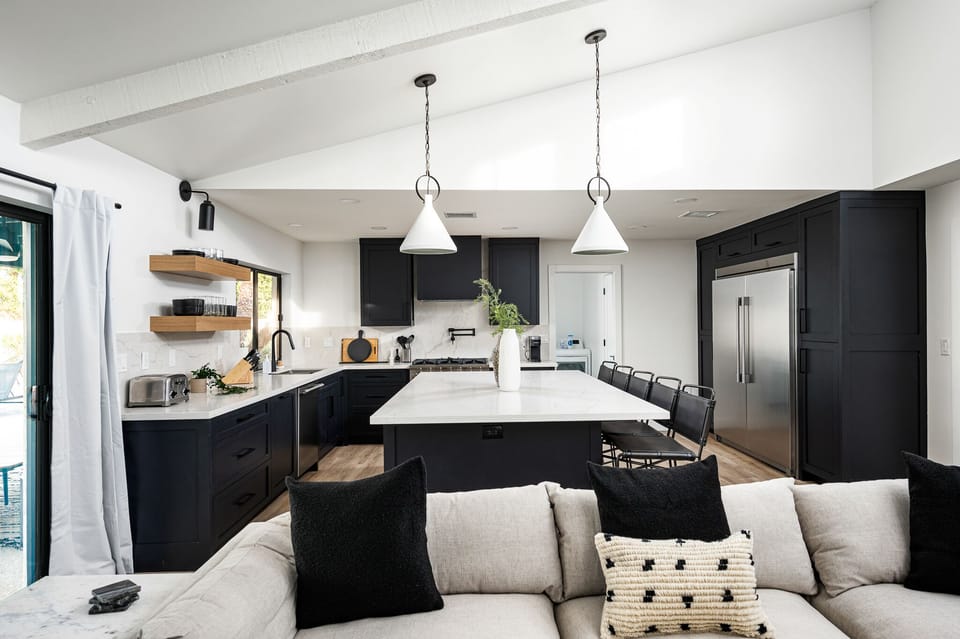Large kitchen island for preparing and dining.