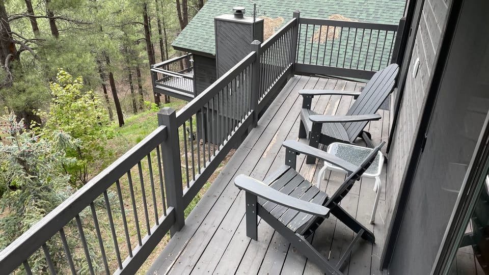 Deck off living room and bedroom. Main house is below.