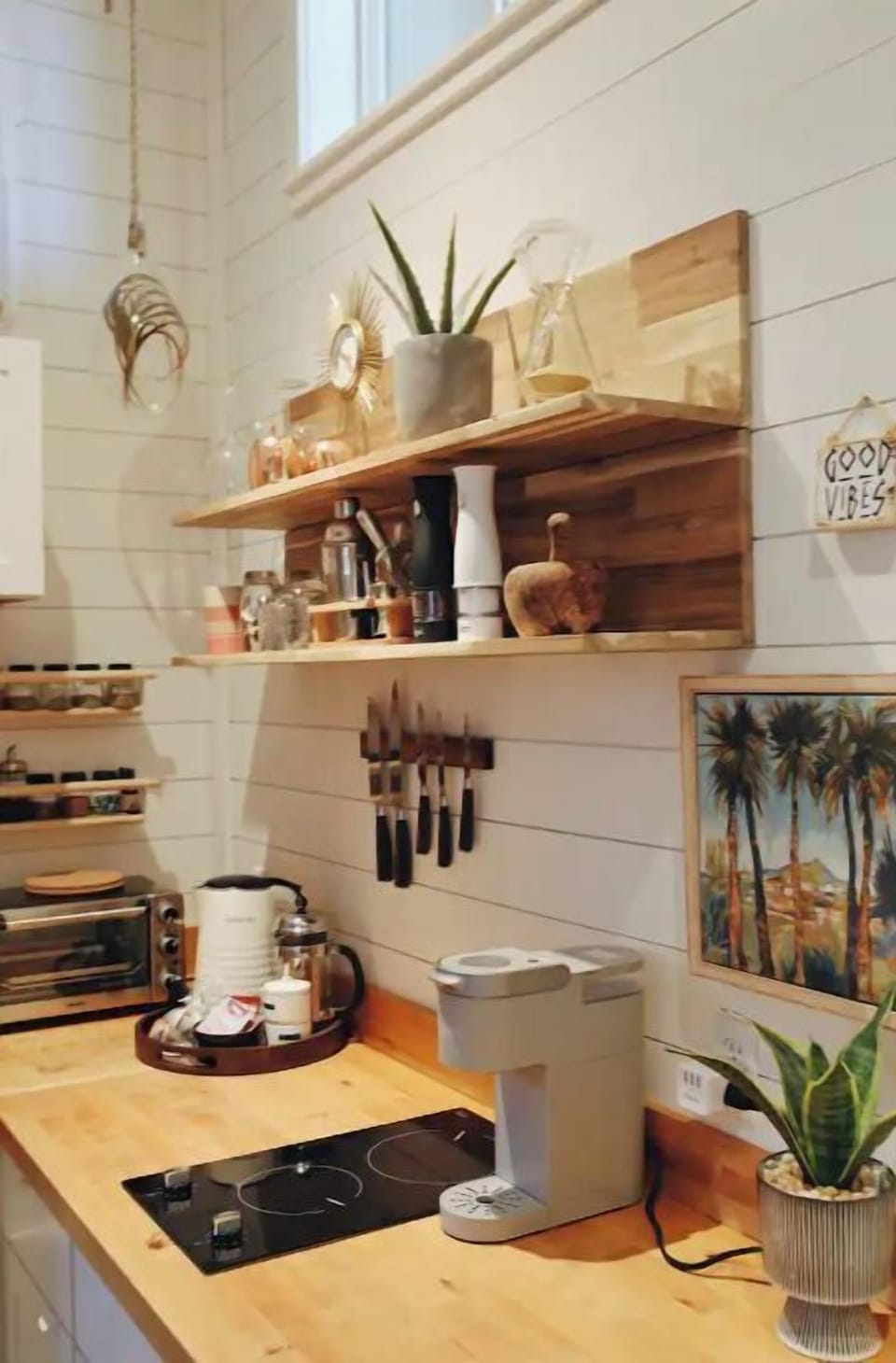 Kitchenette with 2 burner stove, toaster oven, microwave, fridge