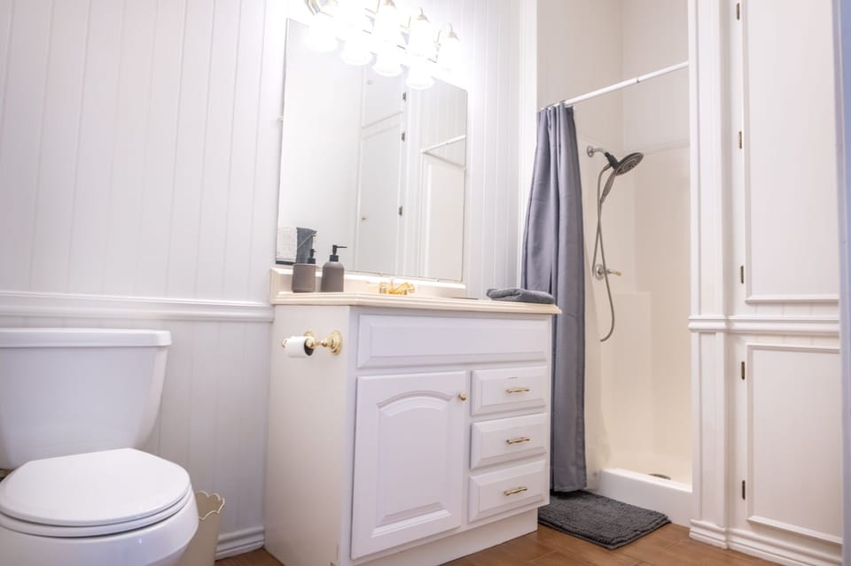 The bathroom has a shower, toilet, sink and good storage areas.  Very roomy.