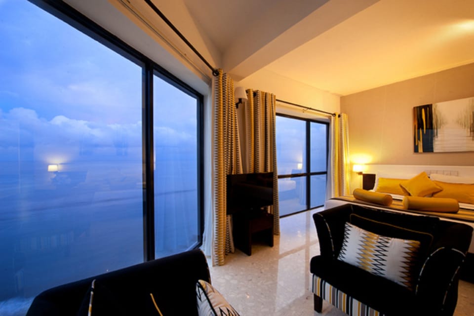 Premier Suite with Ocean View | Living area | Flat-screen TV