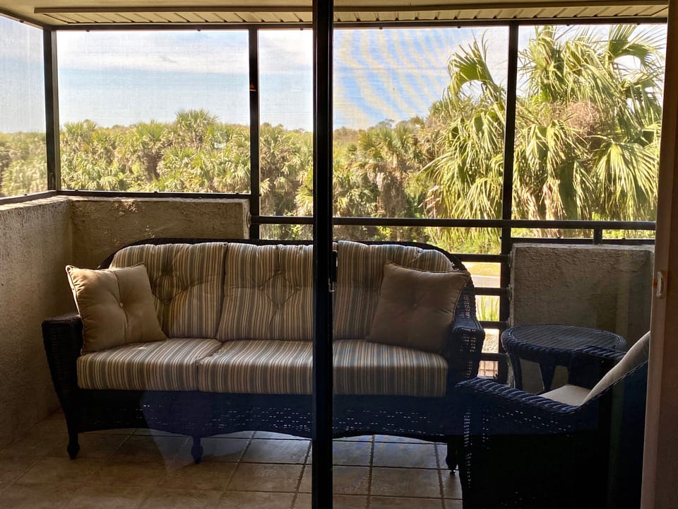 Screen in outdoor lanai area for relaxing
