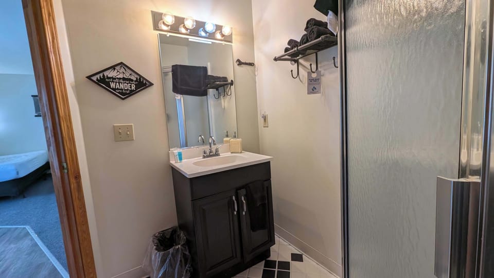 Stand up shower with shampoo, conditioner and body wash provided 
