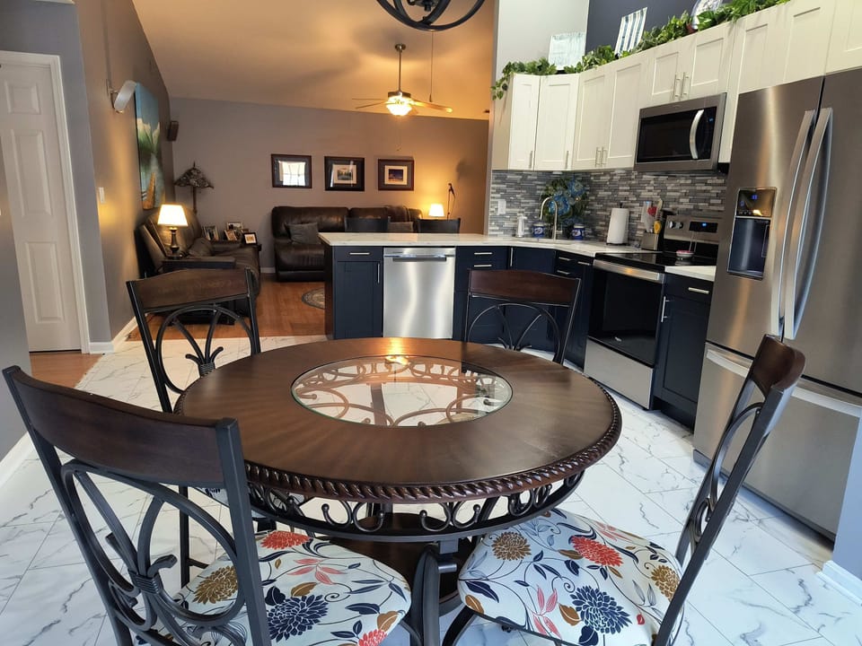 Share meals, board games, or morning coffee in this warm dining space.