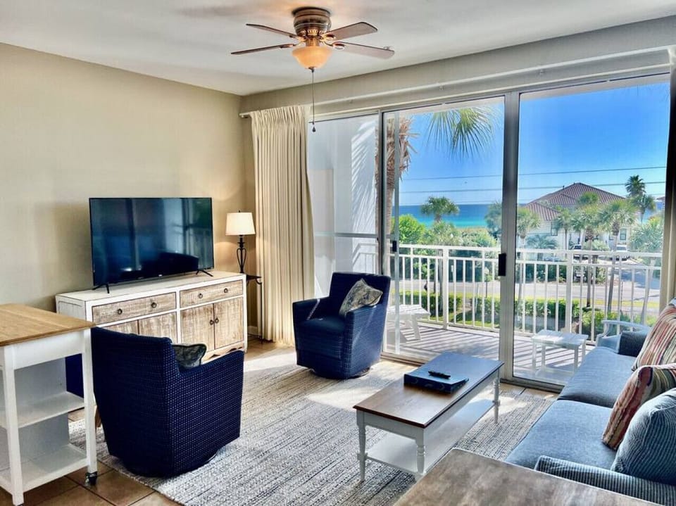 Living room area with seating and balcony