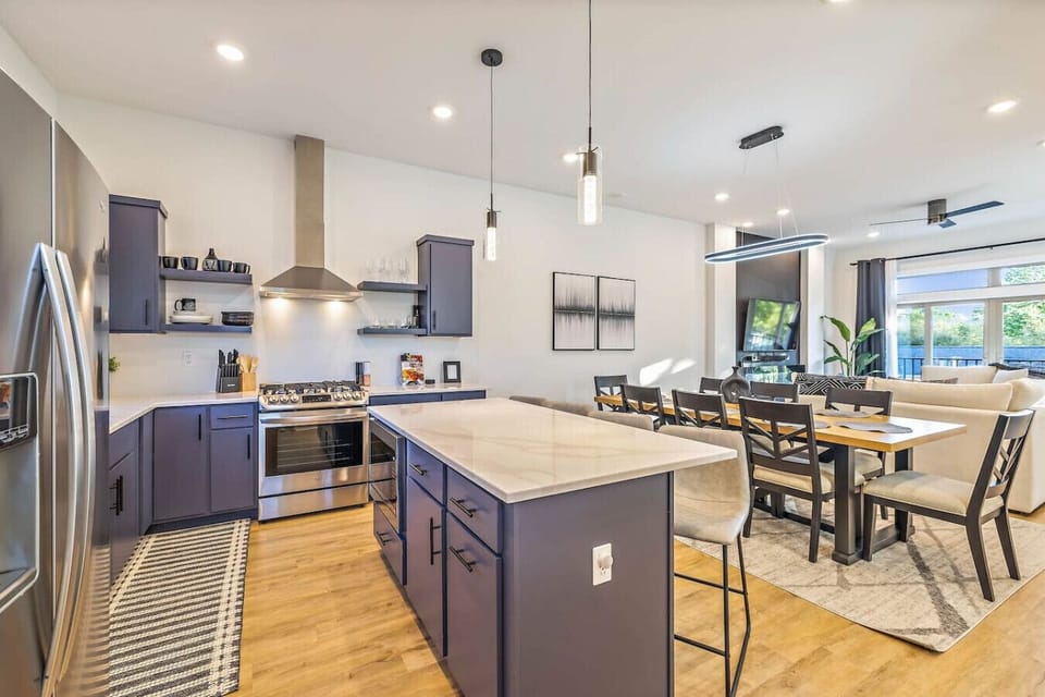 Fully equipped kitchen with dishware and dining seating for 12