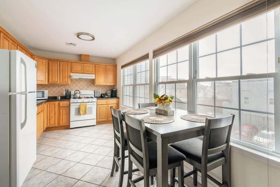Fully stocked kitchen with dining table 
Plenty of natural sun light