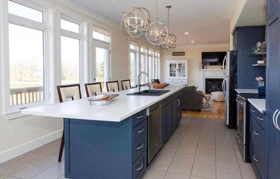 Open concept kitchen with seating for four at the island. 