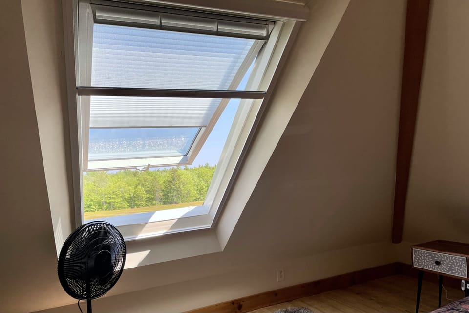 Second floor skylight opens and has a light filtering shade and mosquito screen