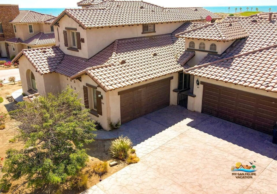 Well-maintained building facade with private entrance and parking — located inside the gated El Dorado Ranch community