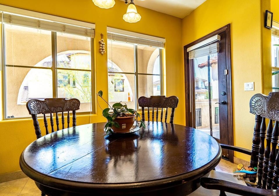 Dining table with seating — located off the living room and kitchen, perfect for group meals