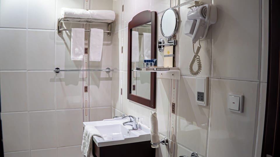 Shower, free toiletries, hair dryer, slippers