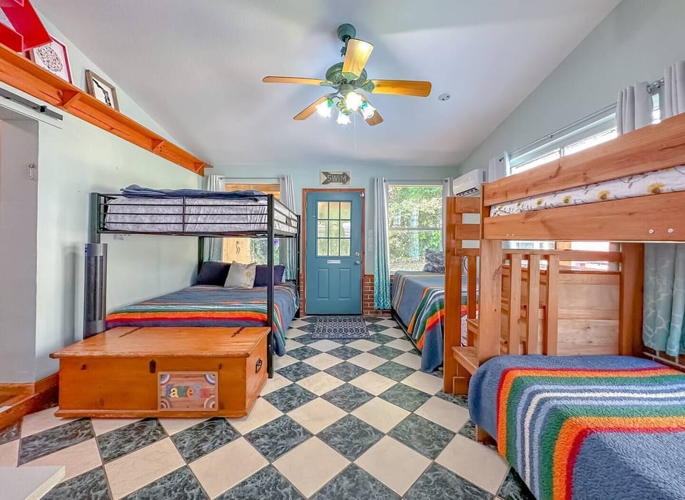 1 queen bunk bed,  1 Twin bunk bed, 1 Full daybed with trundle.  Total of 6 beds
