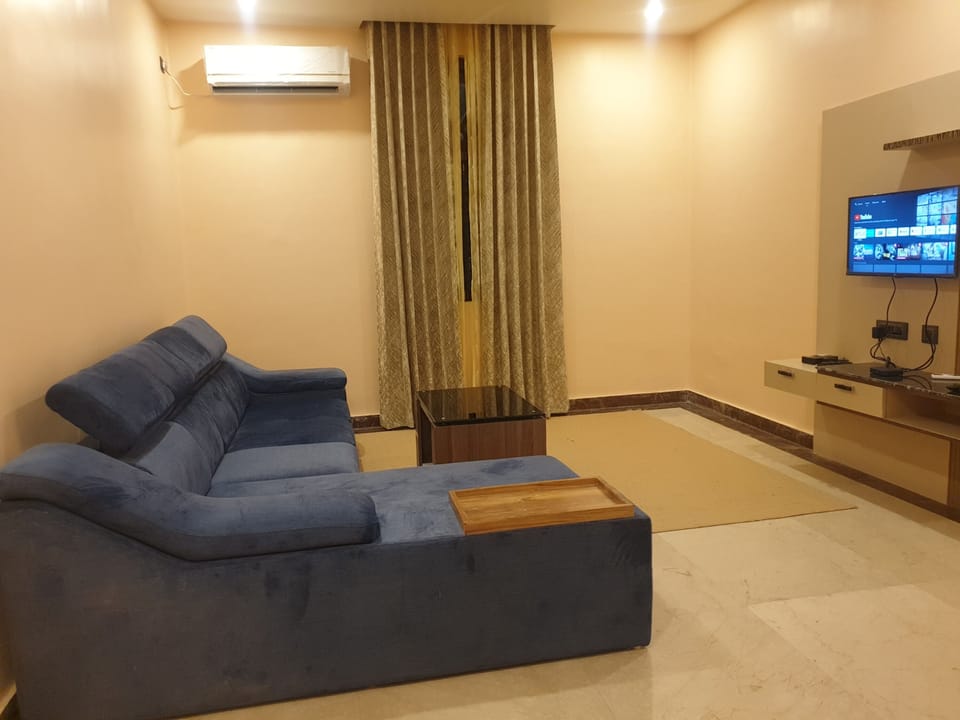 Exclusive Studio Suite | Living room | 42-inch LCD TV with digital channels, TV, pay movies