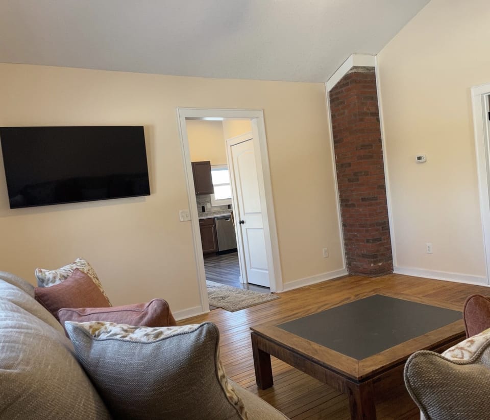 55” TV with Hulu live and Disney Plus in this large living room.