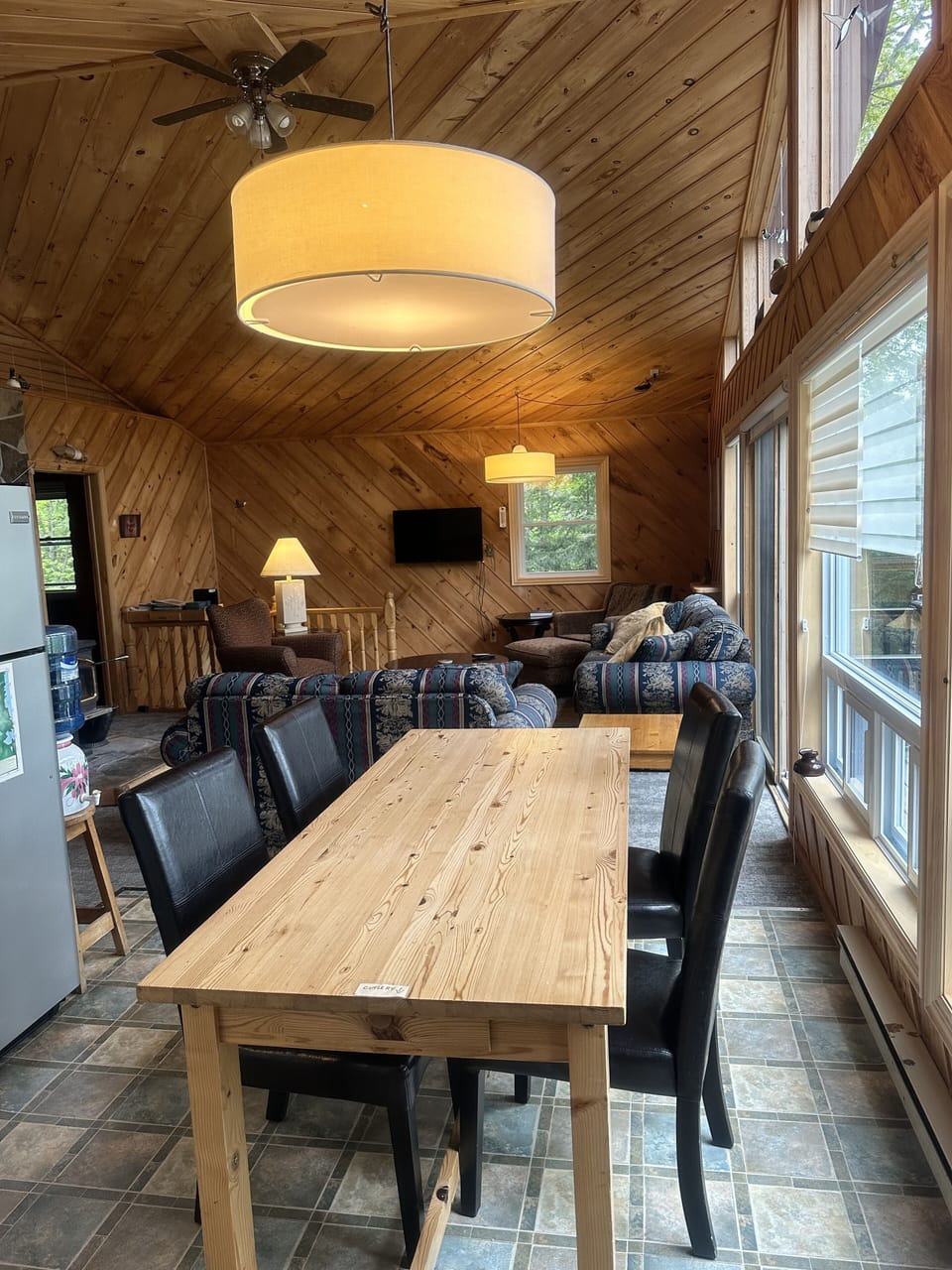 Cottage living area, dining table view from entry.