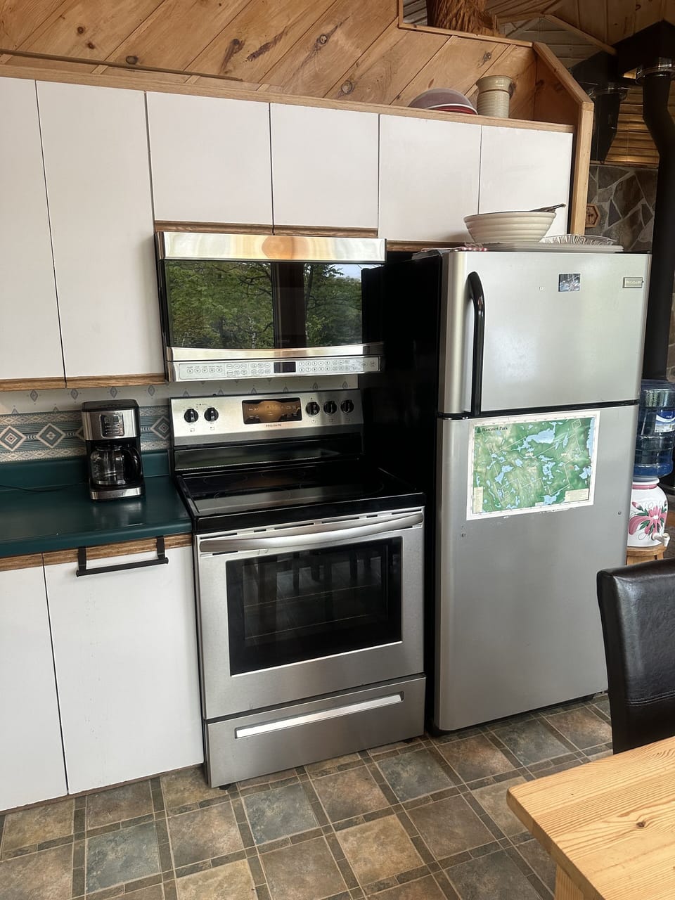 Fridge, microwave, coffee maker, oven.