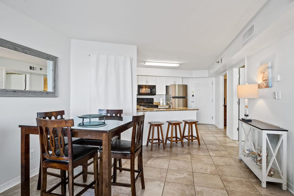Dining table seats 4 and kitchen island seats 3