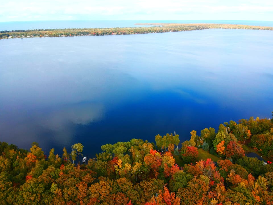 Birdseye view of Lake Independence and Lake Superior in the distance
