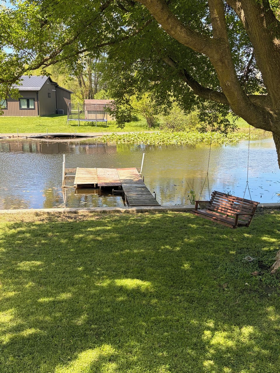 Porch swing on the tree, pier for fishing or docking boats